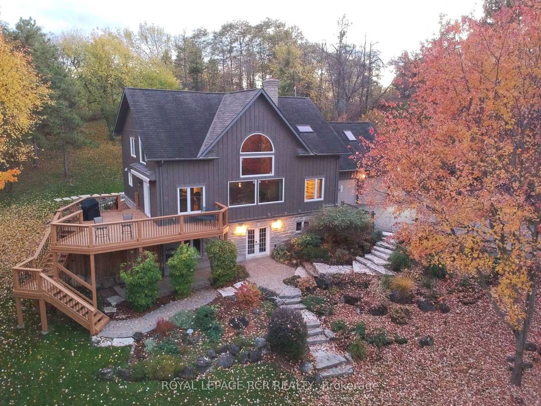 This custom built Post amp ; Beam home sits nestled in a hill overlooking 1.