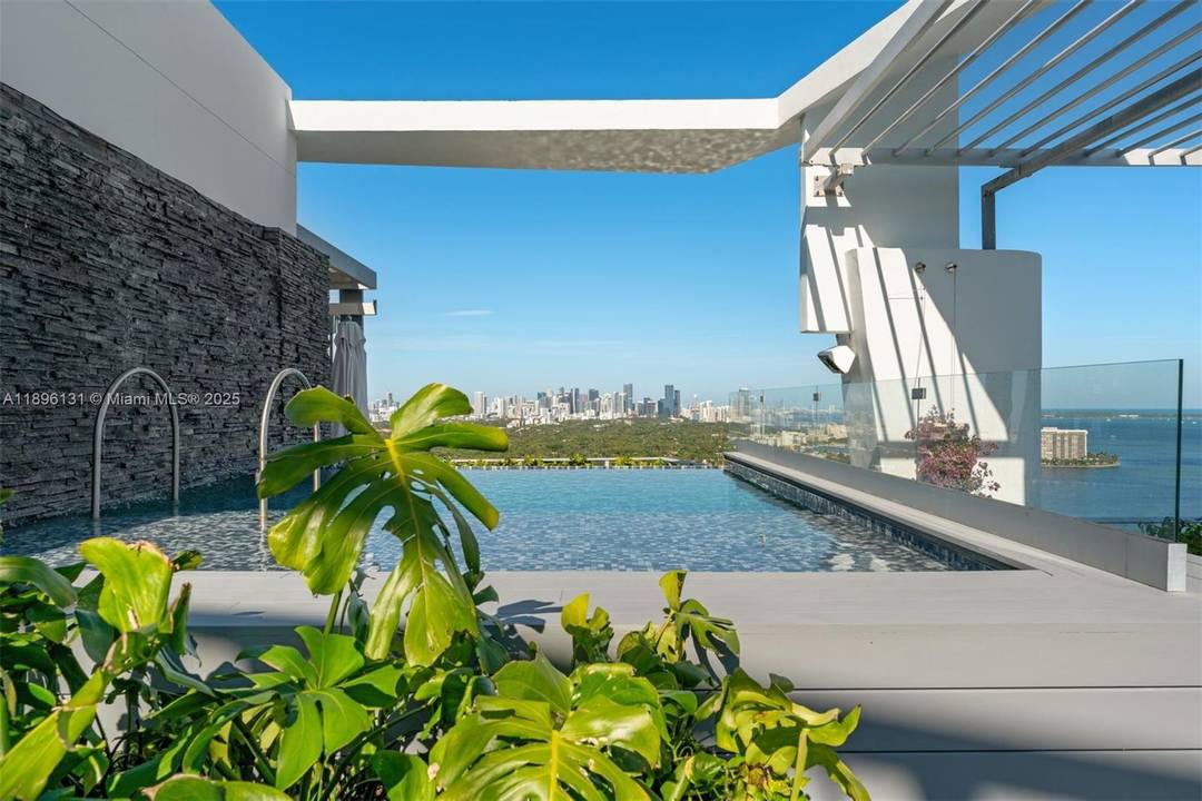 Soaring above Coconut Grove, this 11, 810 SF penthouse at Grovenor House embodies the pinnacle of modern luxury.