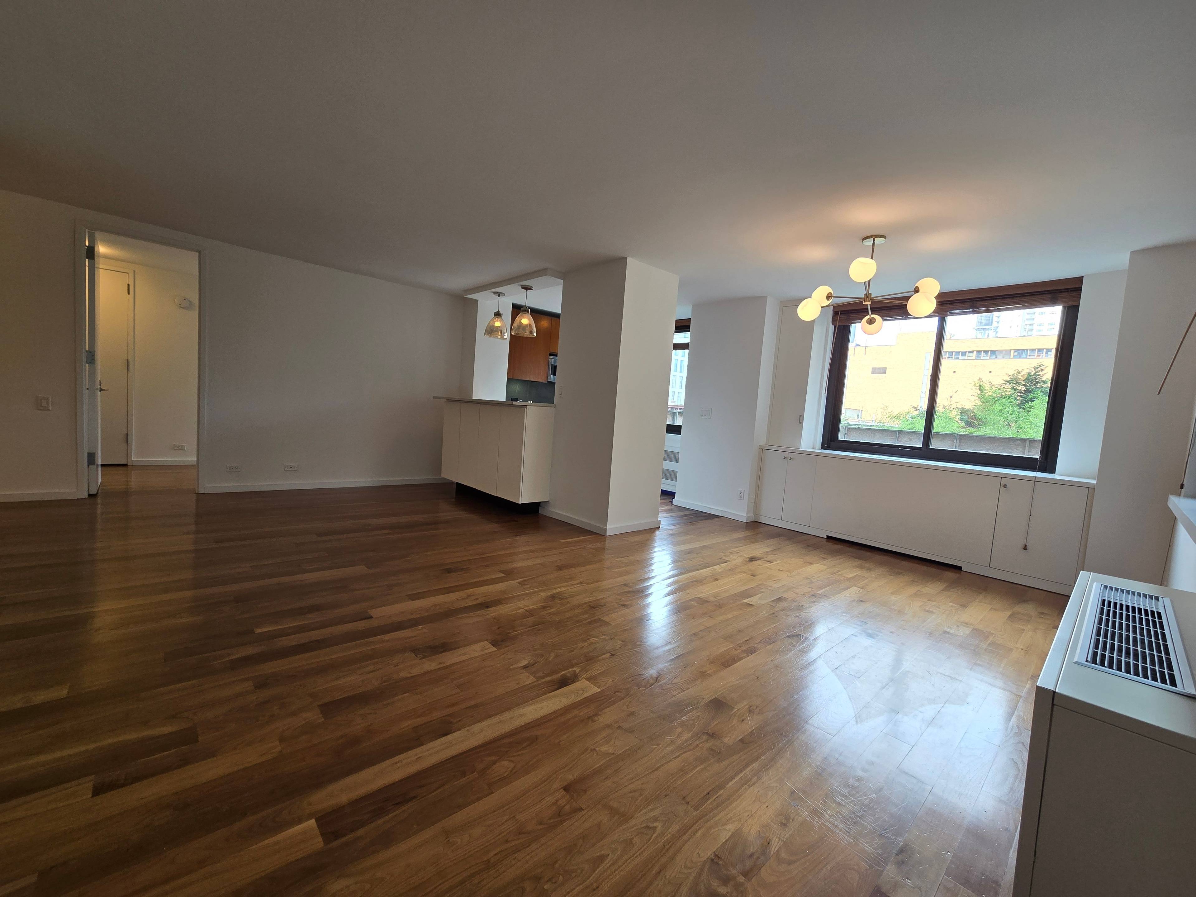 High end open layout split 2 bedroom with formal dining area and open Kitchen bar height counter.