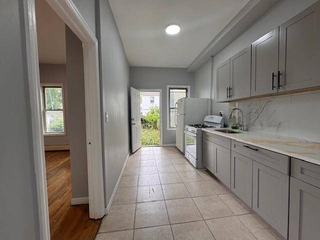 Welcome to this beautifully renovated two family home located at 103 26 171st Street in Jamaica, Queens.
