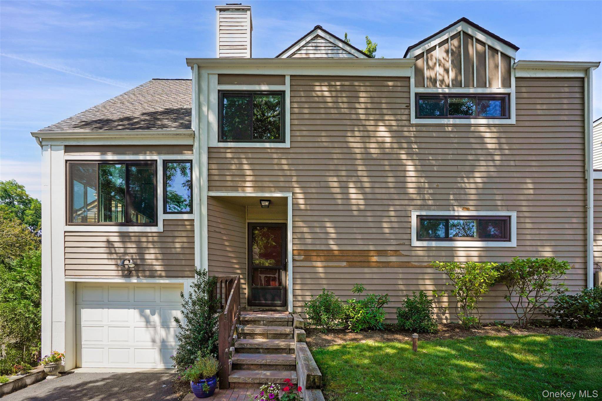 Welcome to this lovely end Townhouse situated in the quiet, friendly and very desirable Top of the Ridge development in Mamaroneck.