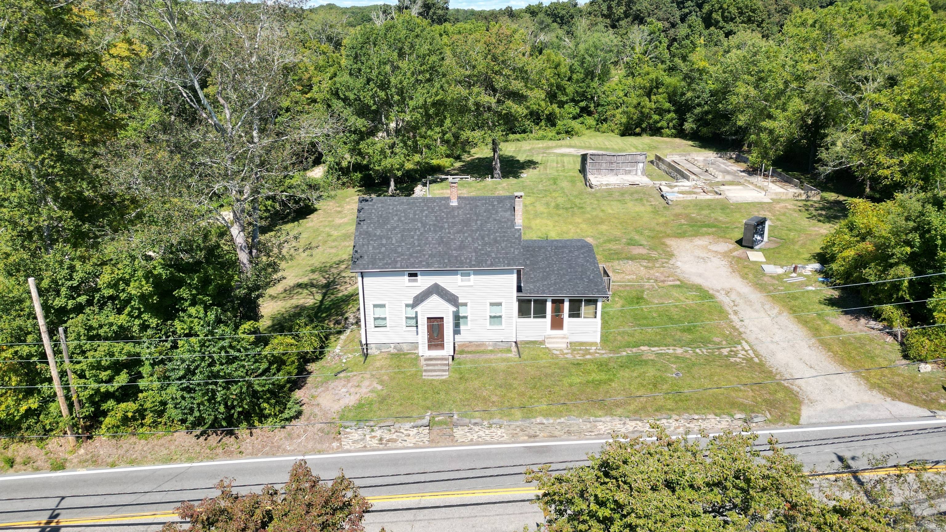 Beautifully renovated 3 bedroom, 2 bath Farmhouse with an office guest room on the Main Level set on 1.