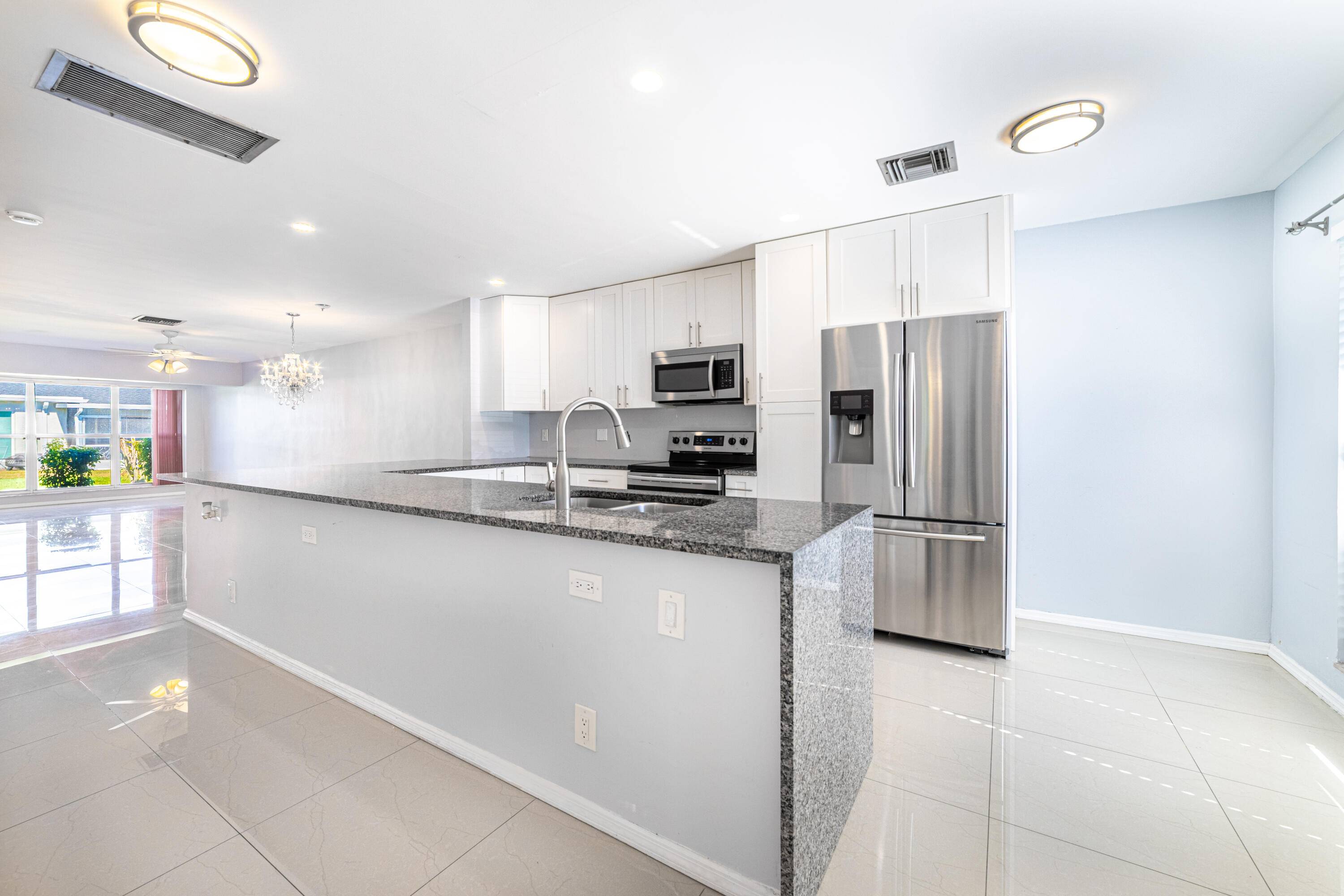 RENOVATED 2 Bedroom 2 Full Bath Corner Villa in the 55 community of Pines of Delray West in Delray Beach.