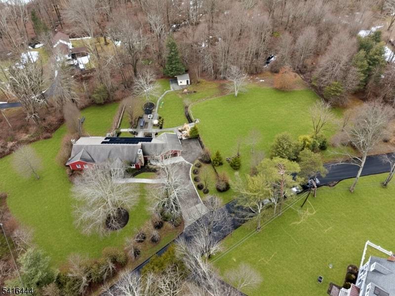 Experience this RARE Sprawling Ranch with HardiePlank Siding situated on a MASSIVE 3 Acre Park Like Estate property within minutes to Downtown Morristown located on the East Side of Mendham ...