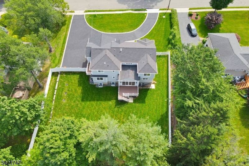 Welcome to this stunning 6 Bedroom, 5 full and 2 half Bathroom, NEW CONSTRUCTION Center Hall Colonial Home with Circular Driveway situated on a sprawling.