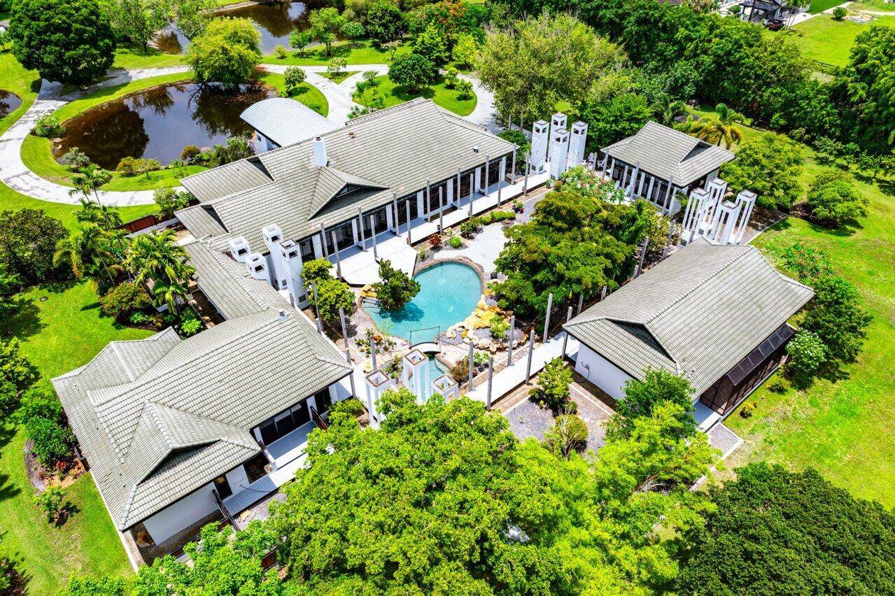 Contemporary Equestrian Estate on 5 Lush Acres with Guest Houses Courtyard PoolA rare and private offering, this architecturally striking contemporary estate is sited on 5 verdant acres and offers approximately ...