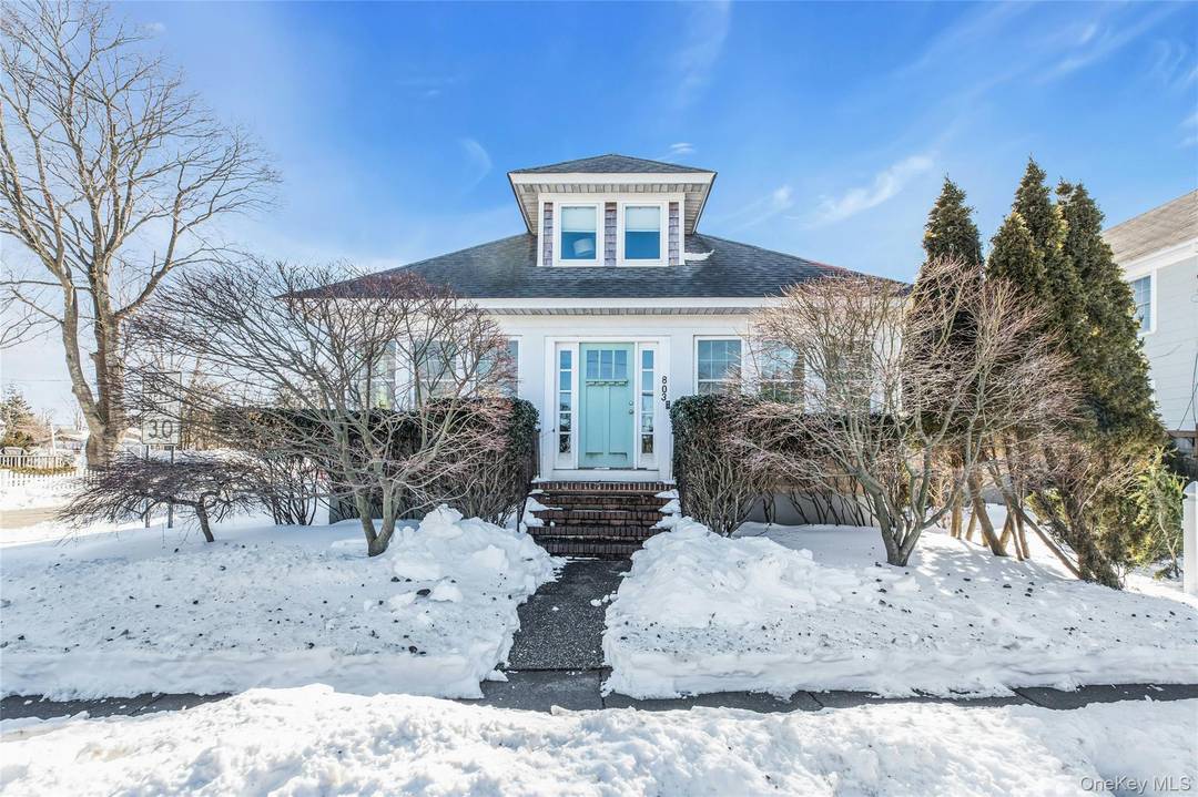 Exquisitely renovated, this charming cedarshake Craftsman, in the seaport village of Greenport, is filled with light.