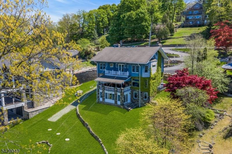 Built circa 1904 as a summer retreat by Gustav Stickley, this extraordinary Lake Hopatcong estate is one of only three privately owned Stickley designed homes known in NJ.