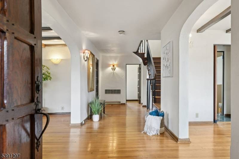 Step into timeless charm at this classic Tudor style home featuring 6 bedrooms, 4.