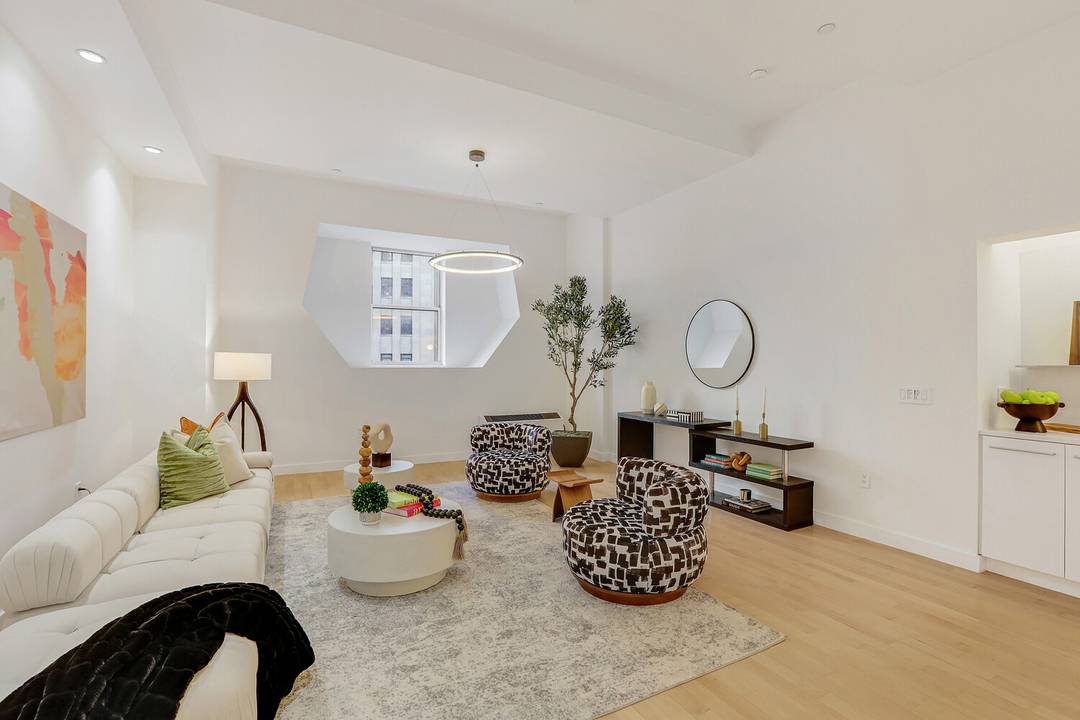 Recently refreshed and professionally staged, Residence 904 now showcases its true scale, with distinct spaces for entertaining, working, and unwinding beneath 13foot ceilings in a full amenity Philippe Starck condominium.