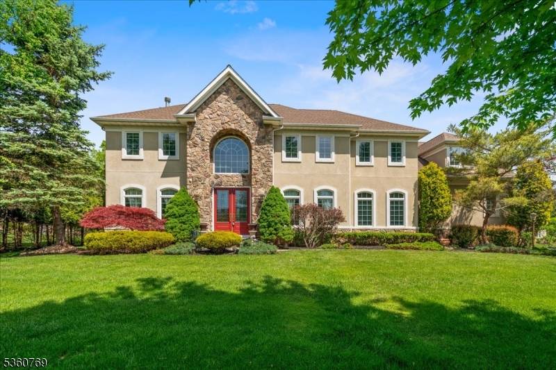 Attention to detail is evident at every turn, from the beautifully detailed millwork and recessed lighting throughout, to the leaded glass front doors and colonial grid windows.
