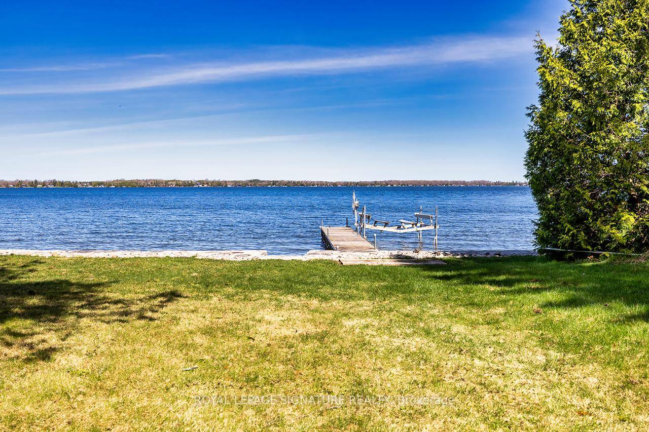 Welcome to 12 Romany Ranch Road, a stunning waterfront property nestled on the desirable shores of Balsam Lake.