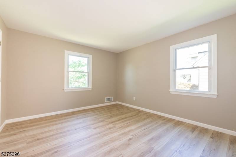 Beautifully updated raised ranch Cape Cod style home featuring 3 spacious bedrooms plus a versatile bonus room ideal for a home office, guest room, or hobby space.