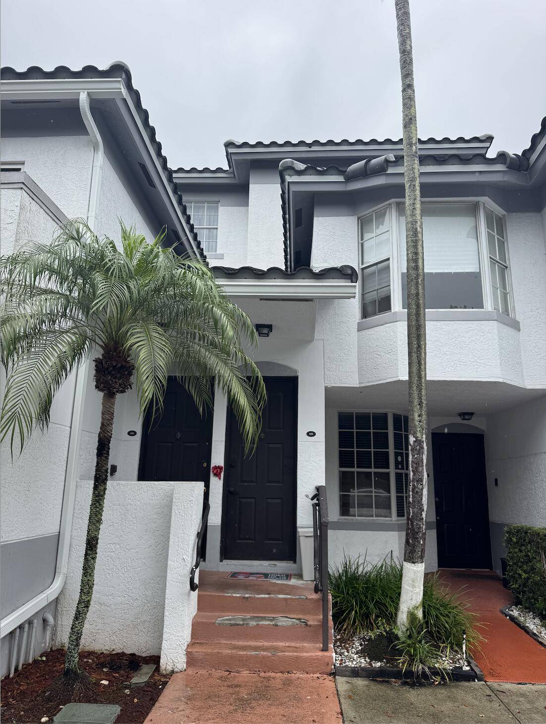 Beautiful Mediterranean styled townhouse featuring 3 bedrooms and 3 full bathrooms.