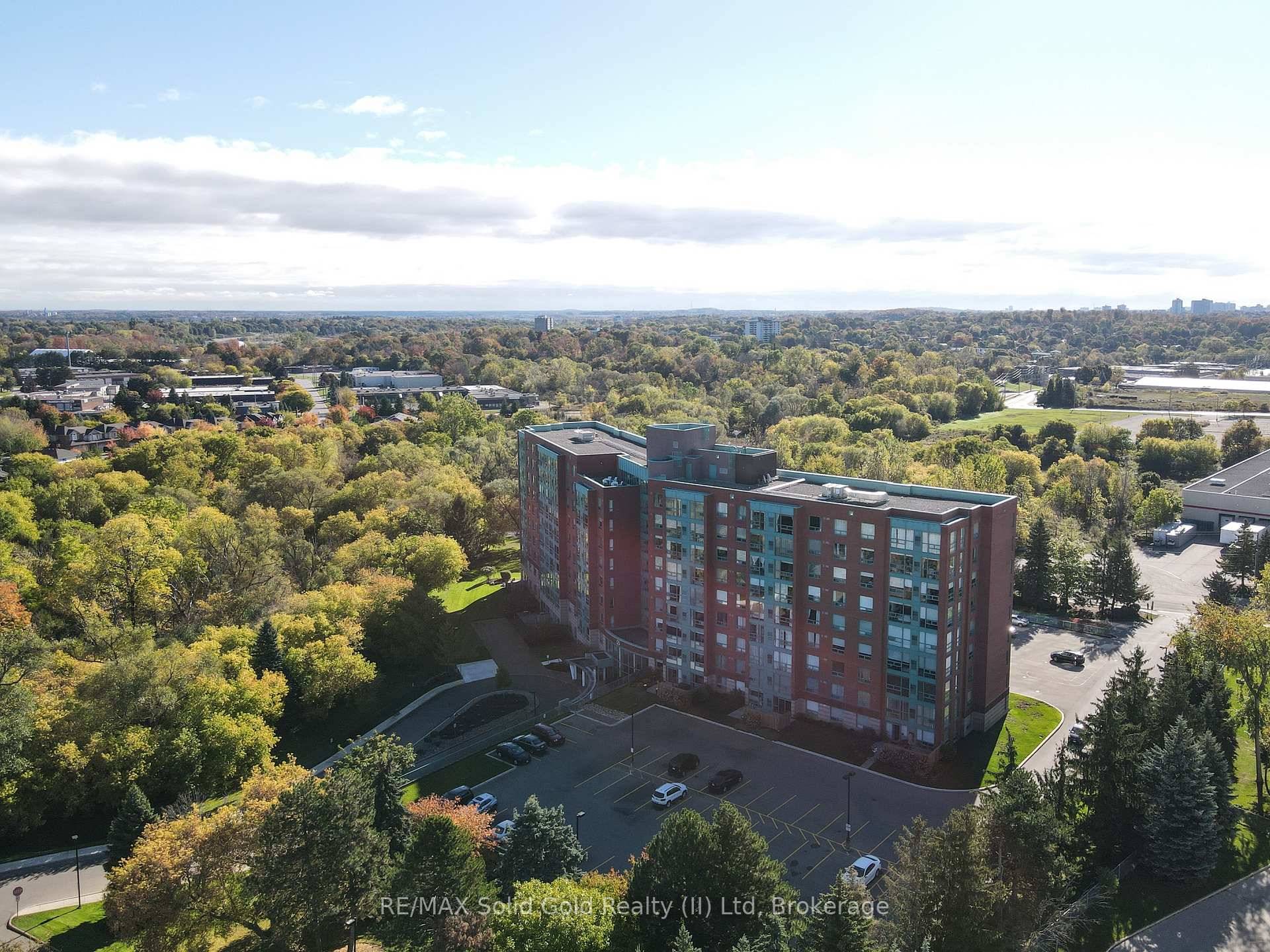 ON TOP OF THE WORLD ! Enjoy the scenic views of the beautifully wooded grounds, trails and sparkling lights of the city through the floor to ceiling windows in this ...