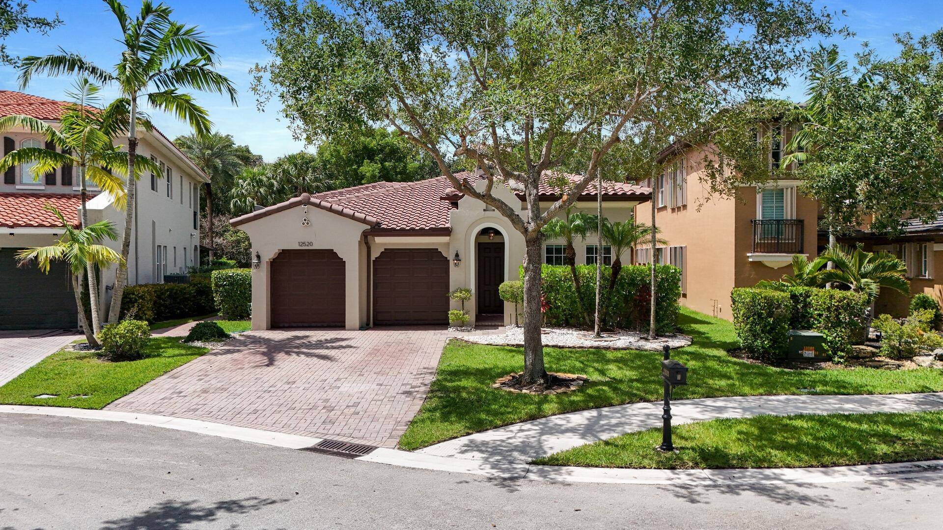 Charming 4 bedroom, 3 bath home boasting a grand foyer leading to a spacious great room and a stylish formal dining area illuminated by transom windows.