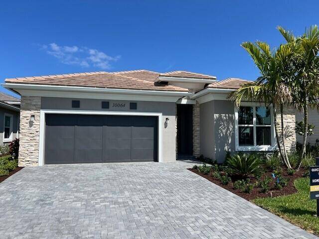 This McKenna home is stunning, boasting a striking Contemporary elevation with sophisticated veneer stone exterior that sets the tone for elegance.
