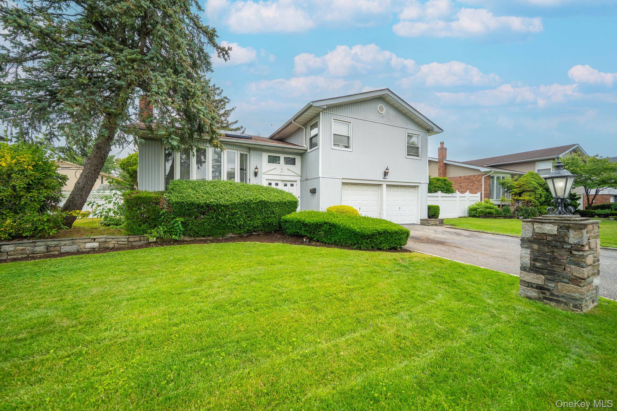 Welcome to 15 Jackie Drive, a meticulously maintained split level home nestled in Westbury's highly sought after Jericho Gardens community.