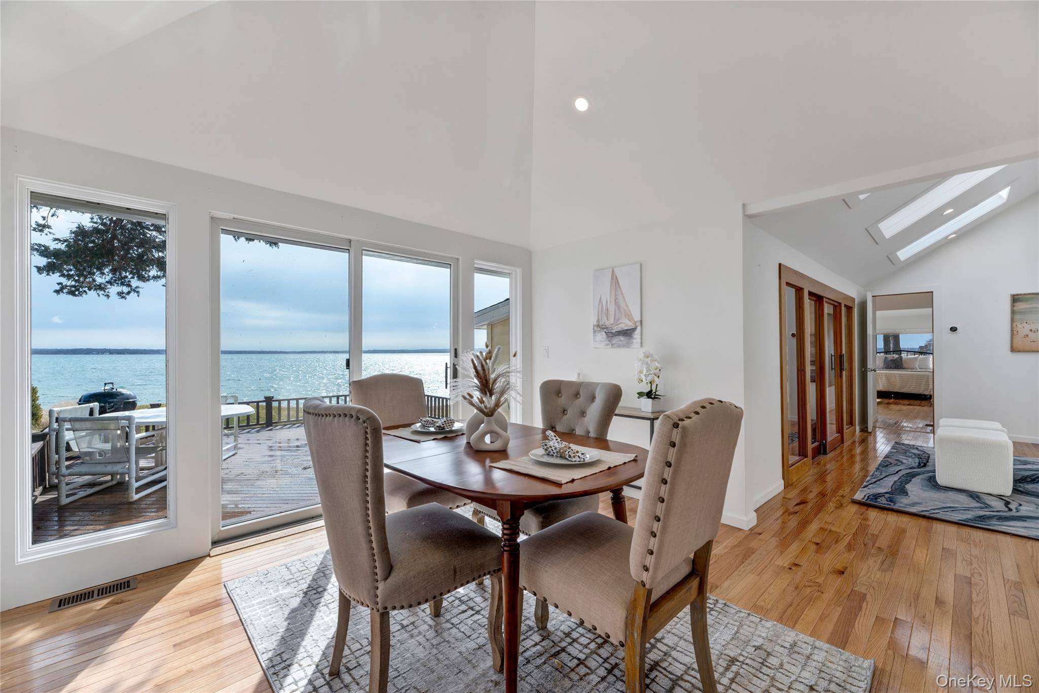 NORTH FORK DIRECT BAY FRONT GEM ON QUIET STREET WITH HIGH ELEVATION AND 115' FRONTAGE Introducing a captivating waterfront property on the Peconic Bay in Jamesport boasting a large lot ...