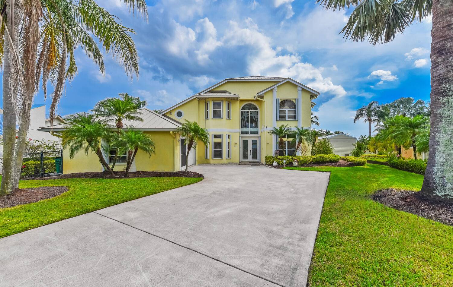 Enjoy tranquil water views and beautiful breezes from the back porch of this gorgeous home that sits on a cove in the St.