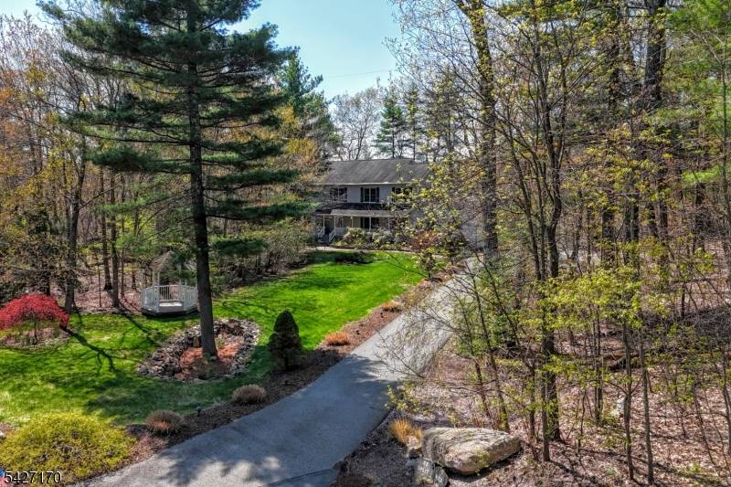 Magnificent Center Hall Colonial located in sought after Alpine Ridge Estates perfectly positioned at the end of a cul de sac.
