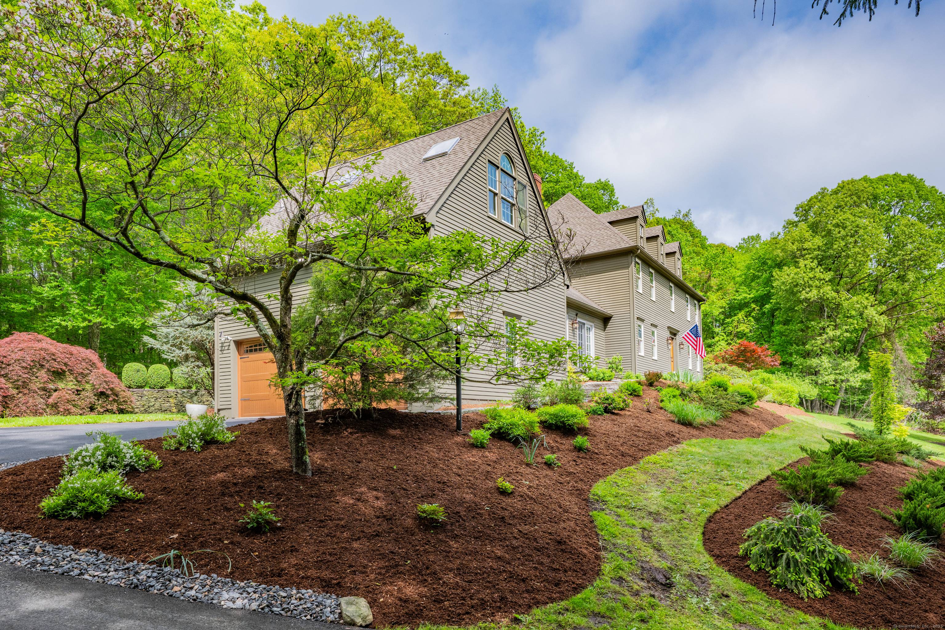 Beautifully constructed and perched atop a scenic 3 acre lot, this stately gambrel colonial is just a 5 minute drive from charming downtown Woodbury.