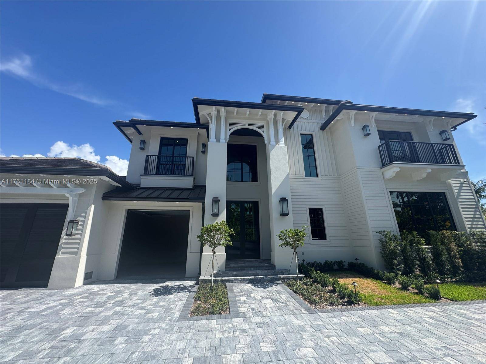 Brand new construction waterfront estate featuring a new 100 ft waterfront concrete seawall and deck, with easy deep water ocean access and a backyard tropical pool oasis.