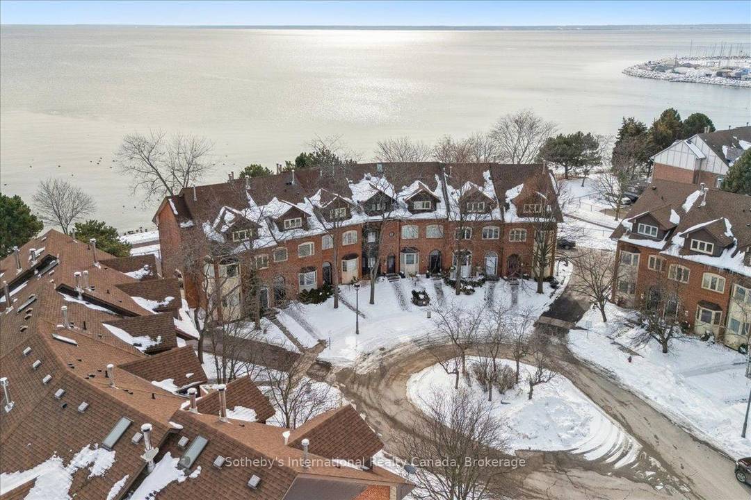 Rarely offered, true lakefront freehold townhouse in prestigious Bronte with unobstructed, panoramic views of Lake Ontario.