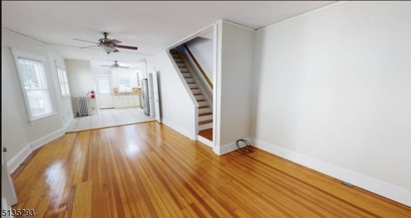 AVAILABLE SEPT 15th. 2 blocks from train, town center, Open front porch welcomes you to this fabulous duplex with open floor plan and wood floors.