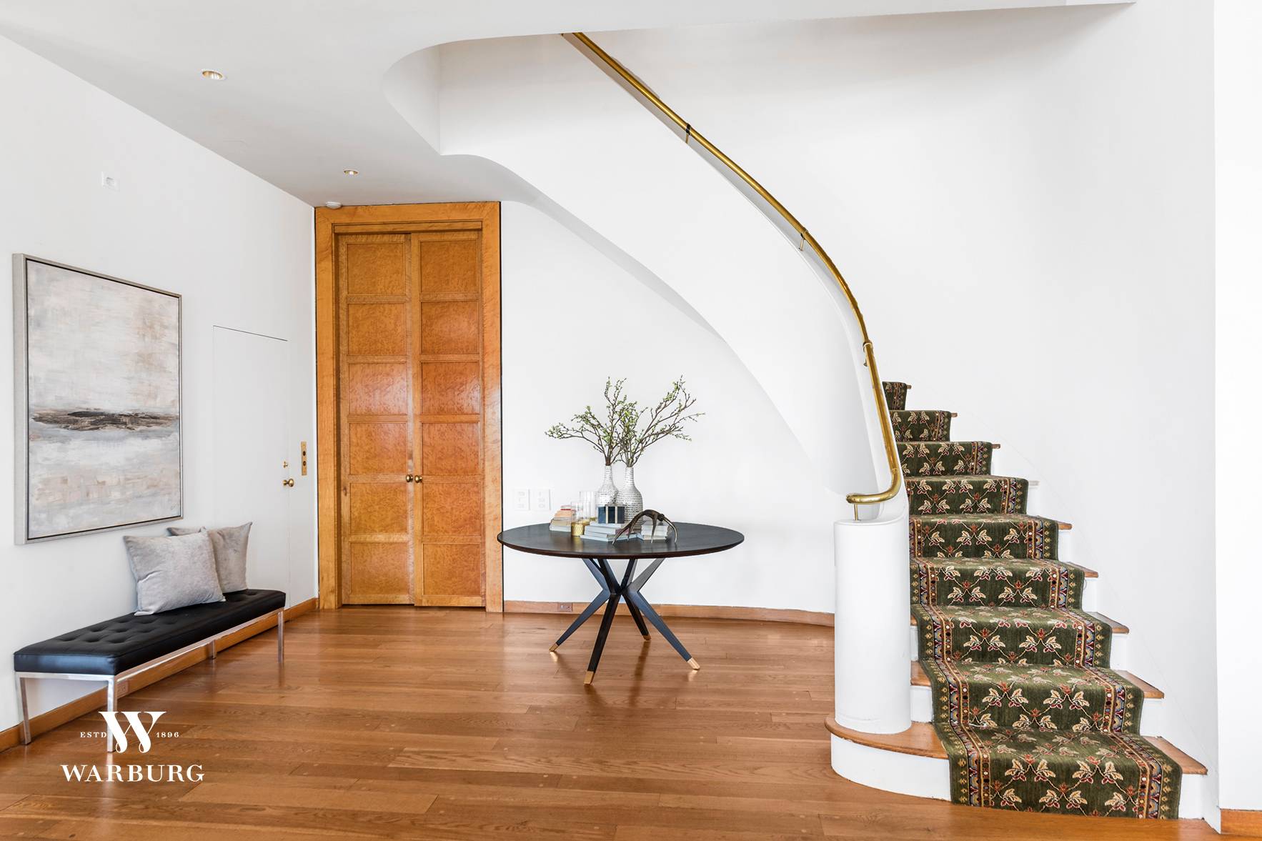 At the top of the renowned River House cooperative, this private tower residence spans two full floors with stunning panoramic views of New York City and the East River.