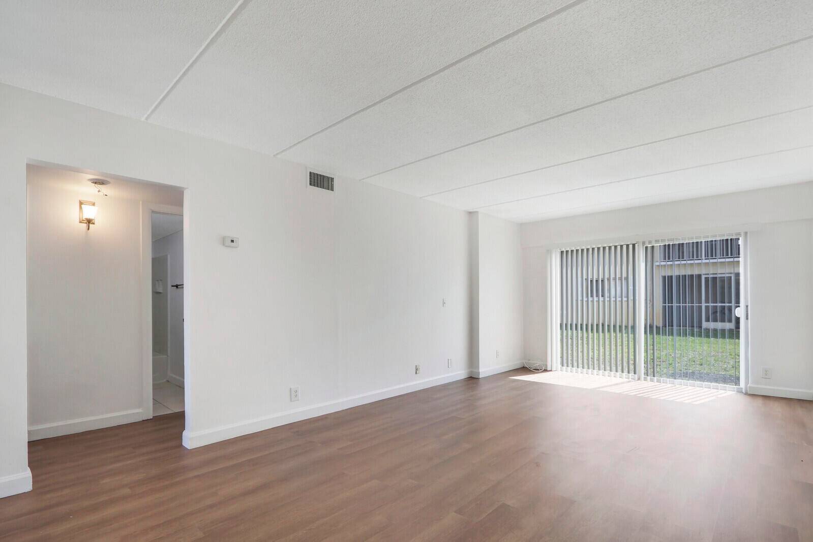 Renovated ground floor 2 br, 1 ba with BRAND NEW hurricane impact glass windows.