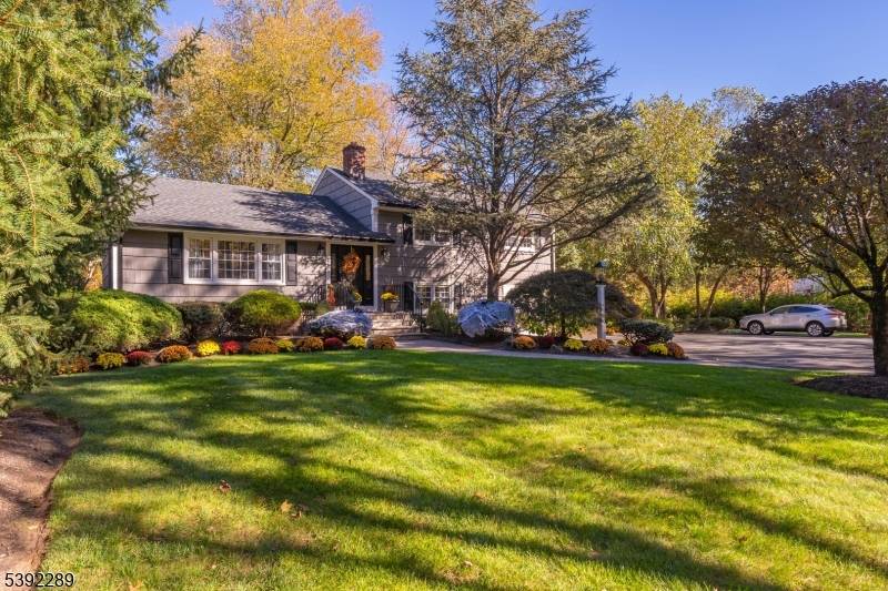Welcome to this beautifully Bi Level Split situated on over an acre of peaceful, park like property in desirable Basking Ridge Township.