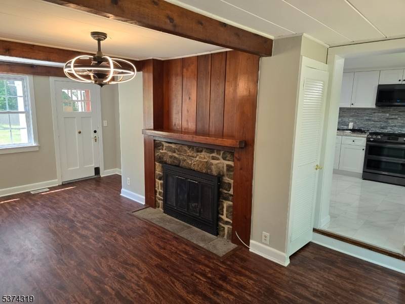 Sunny and bright custom home offering updated kitchen and baths, hardwood floors, and private corner lot.