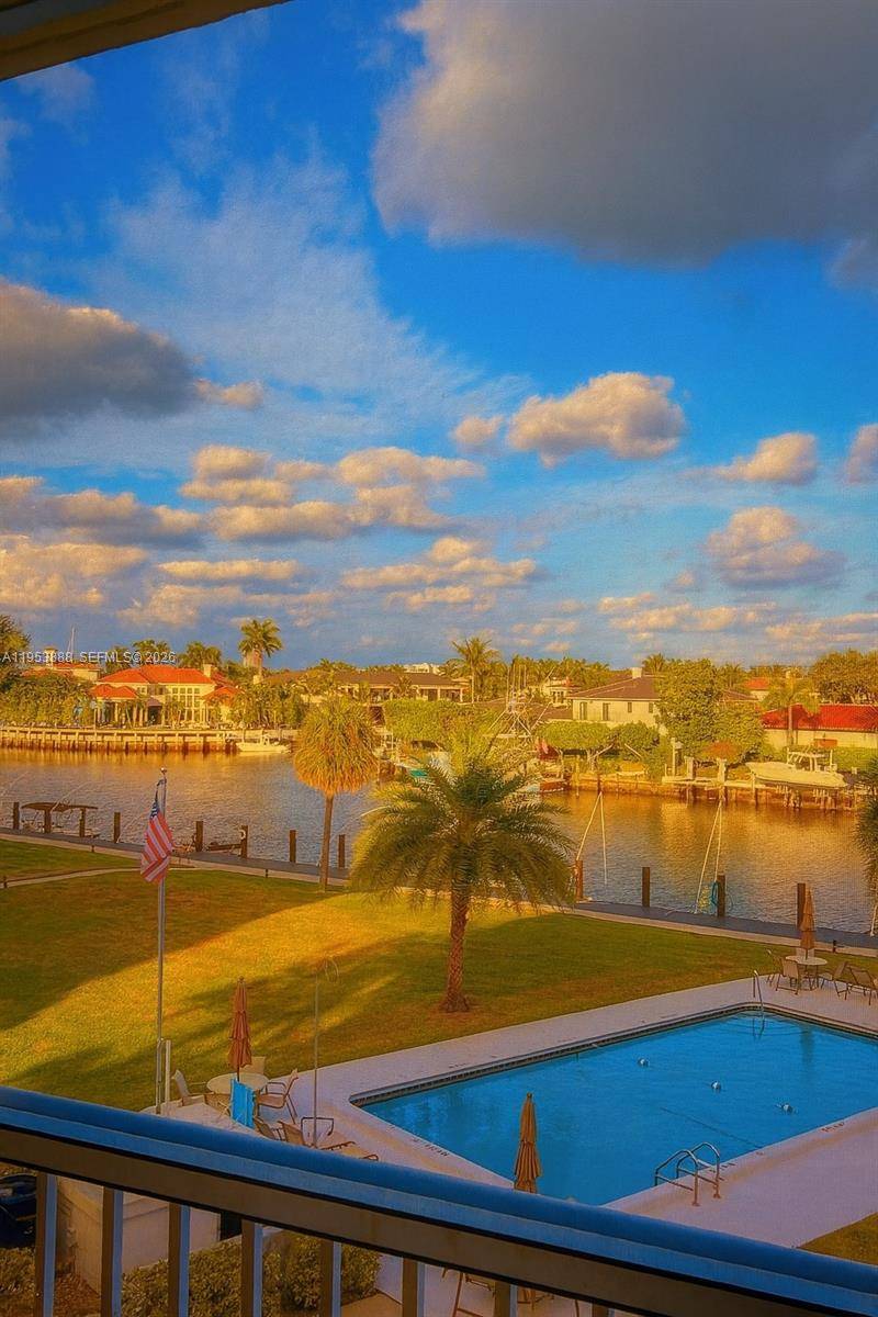 2BR 2BA condo with balcony facing garden and water views.