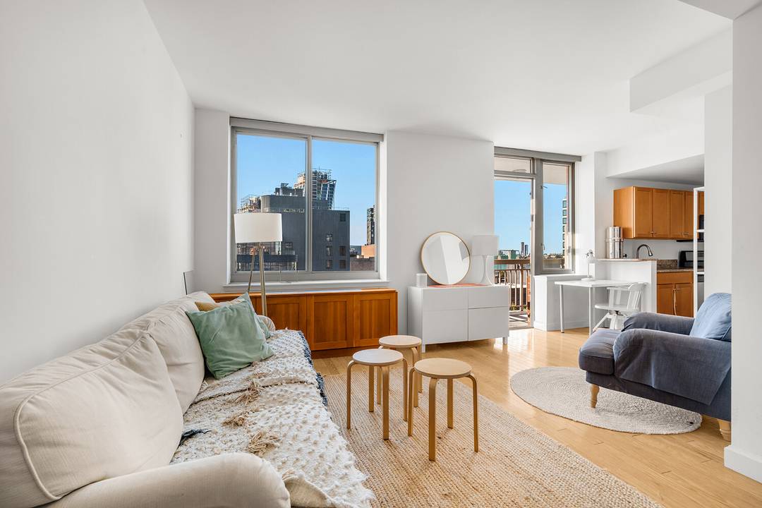 Private balcony overlooking the High Line with beautiful city and Hudson River views.