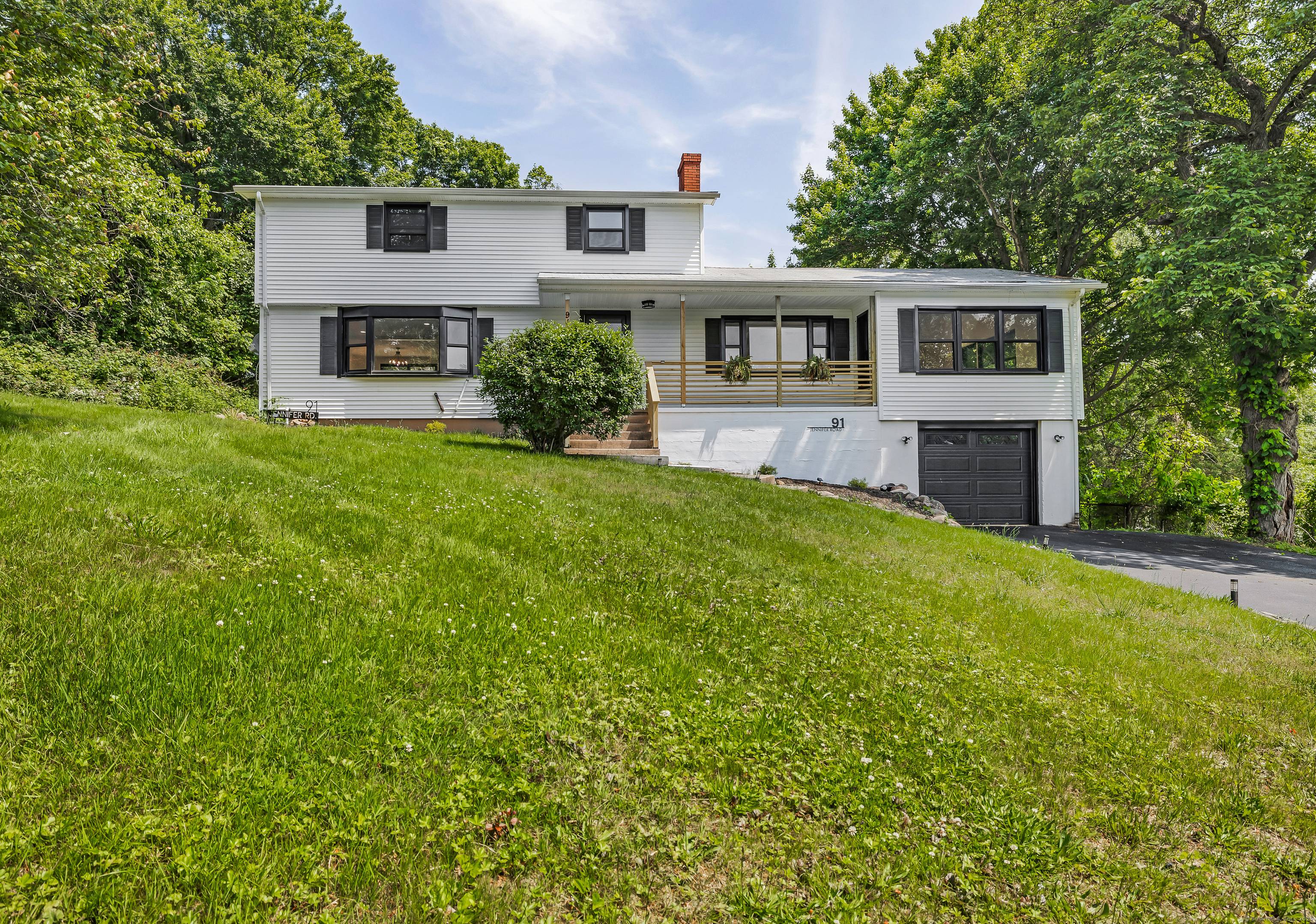 Welcome to 91 Jennifer Rd, a beautifully renovated three bedroom, one and a half bath Colonial nestled at the top of the hill in one of Hamden's most desirable neighborhoods.