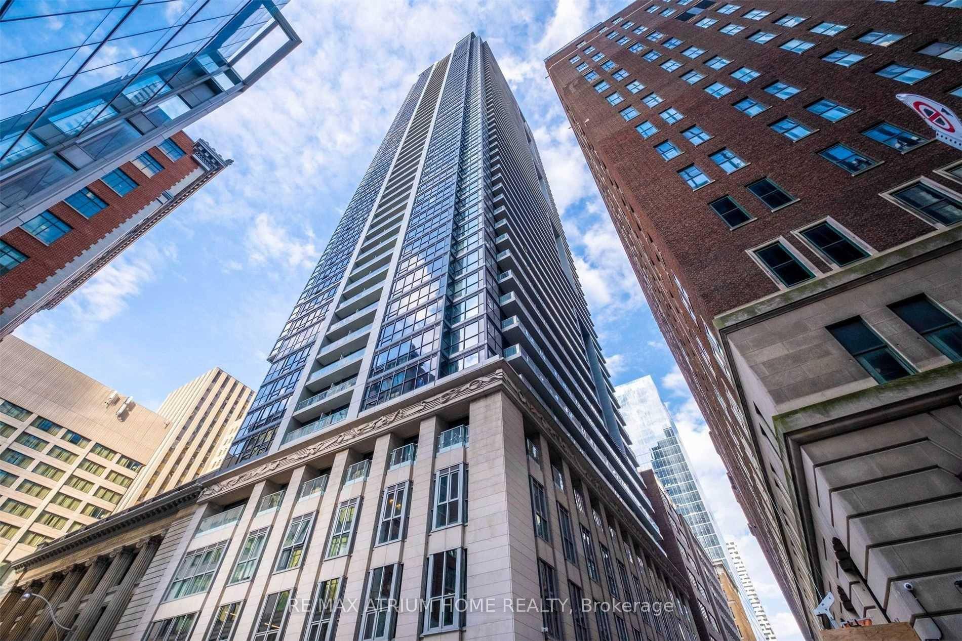 Luxuriously furnished unit overlooking Nathan Phillips Square, offering spectacular sunset views from a spacious balcony.