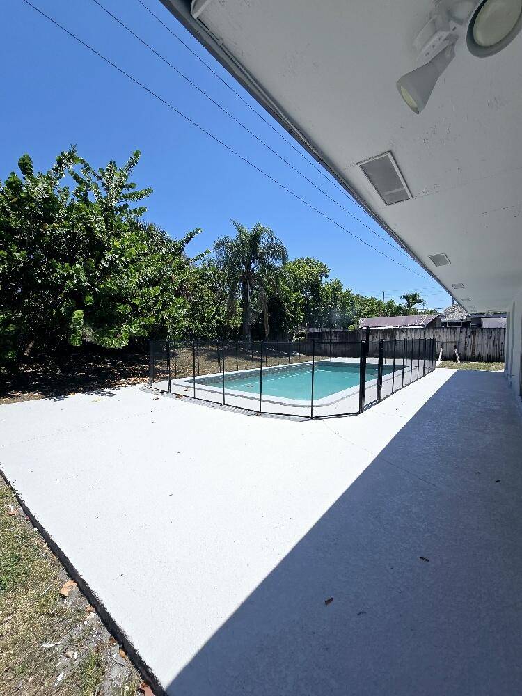 3 2 TOTALLY FRESHLEY PAINTED INSIDE AND OUT, NEW FLOORING, POOL HOME ON 1 4 ACRE.