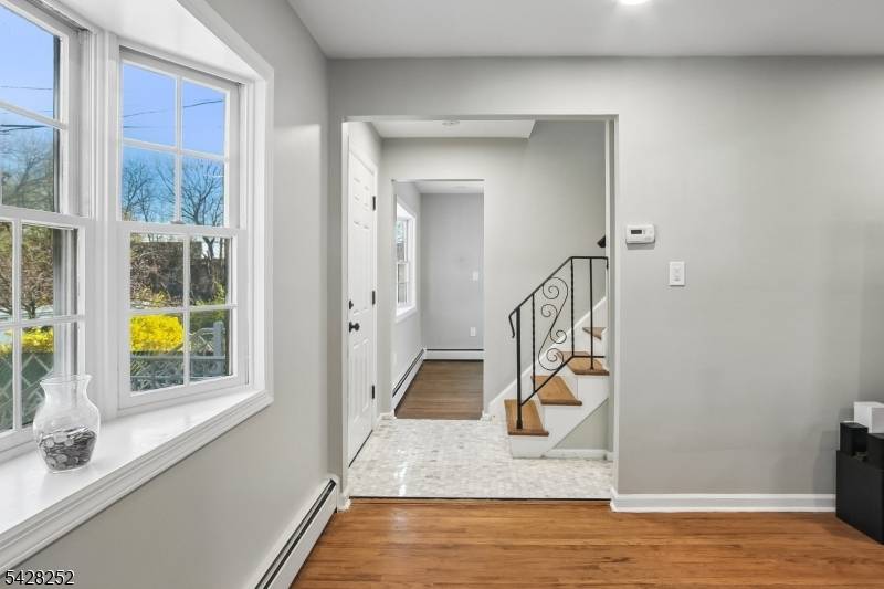 Welcome to this charming 1971 Colonial, perfectly situated in a tranquil neighborhood near the Smallwood Avenue circle.