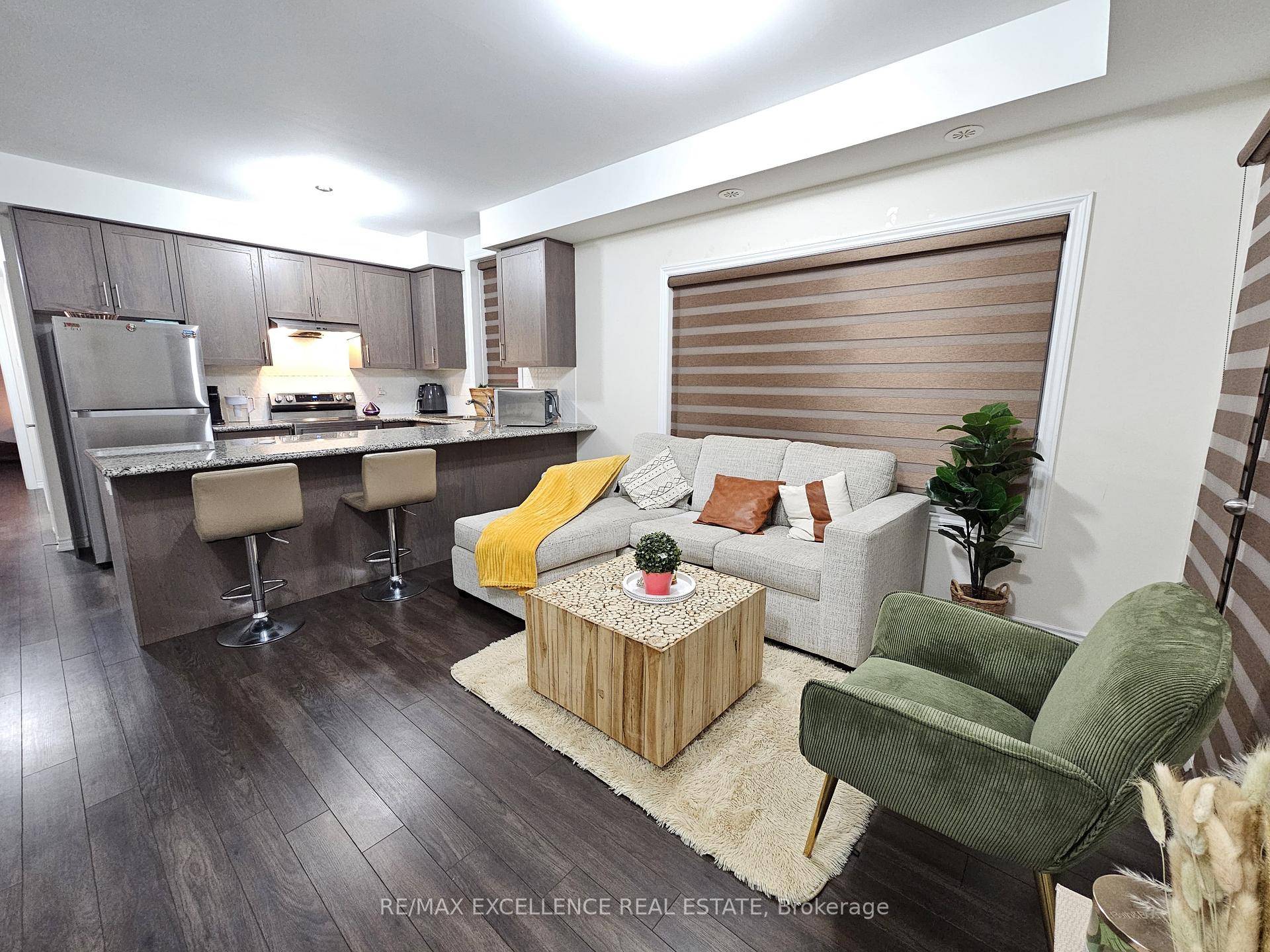 Modern and bright stacked townhouse offering 2 spacious bedrooms, 1 full bath, and an open concept layout, perfect for comfortable living.