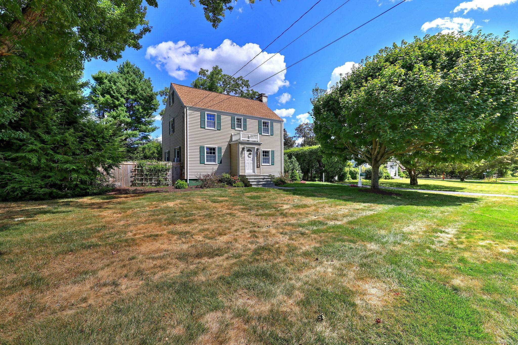 Charming 3BR 1. 5 Bath Colonial located in the heart of Long Hill situated on a level lot with private backyard.