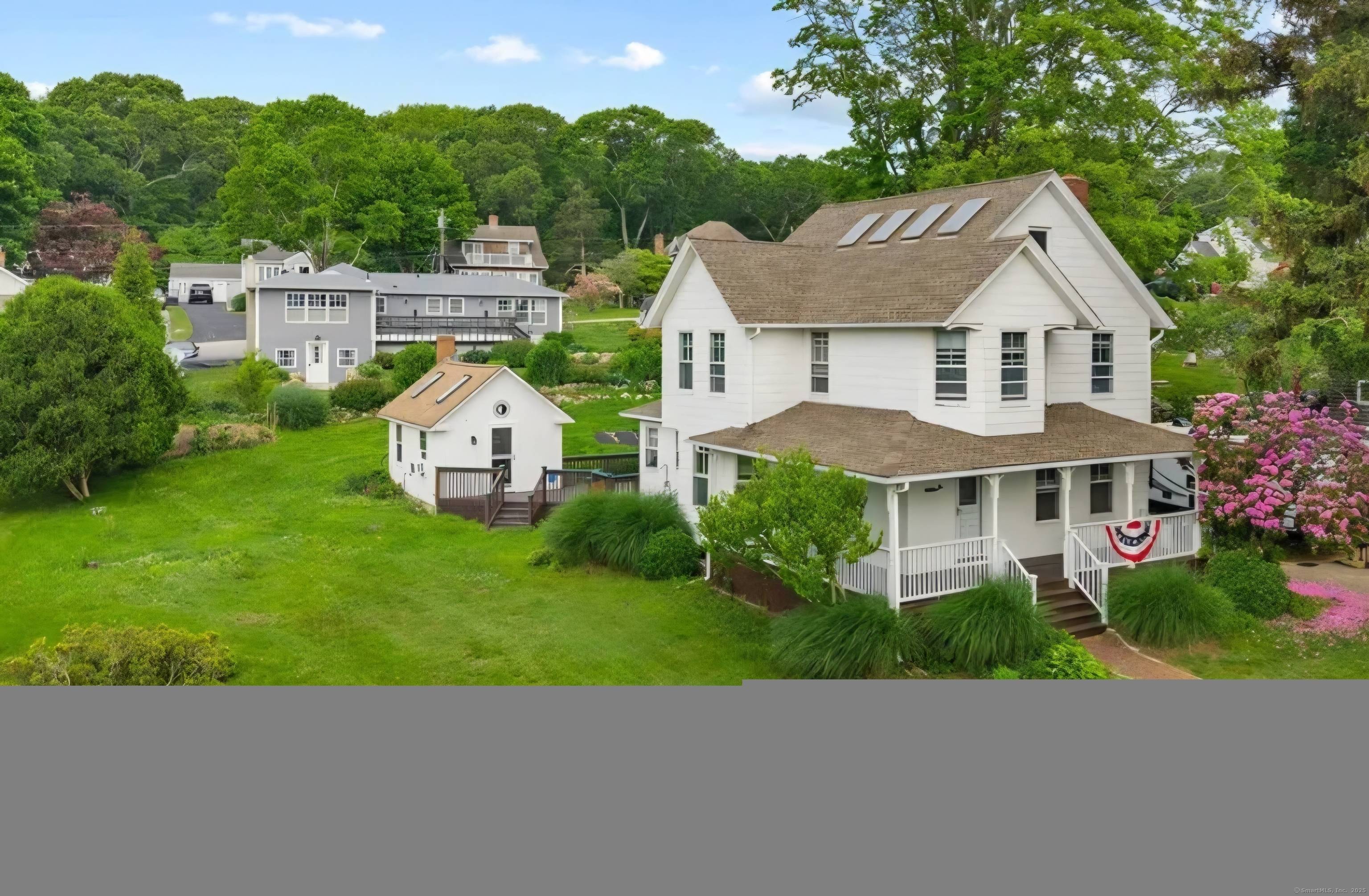 Furnished Noank Colonial across from Beebe Cove with year round views.