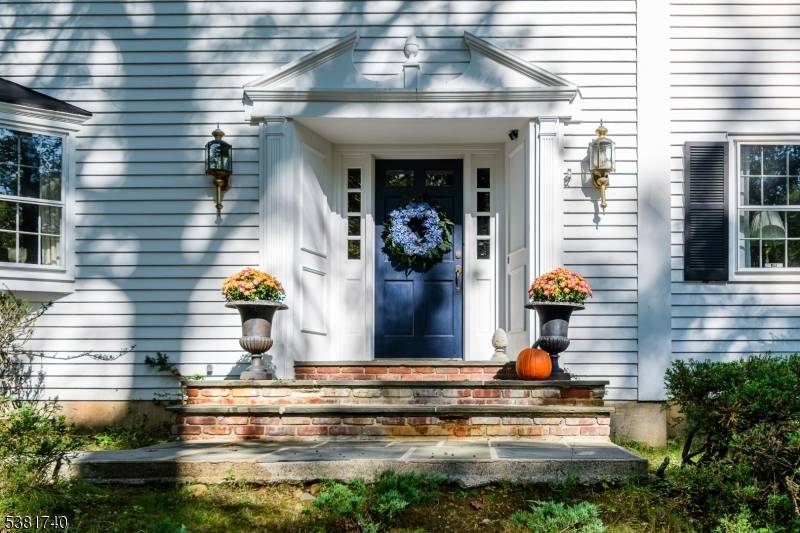 SUPER TRADITIONAL COLONIAL SET ON LARGE PRIVATE WOODED LOT OFFERS EH, LR, FDR, COUNTRY EIK W SLIDER LEADING TO PATIO IN GROUND POOL.