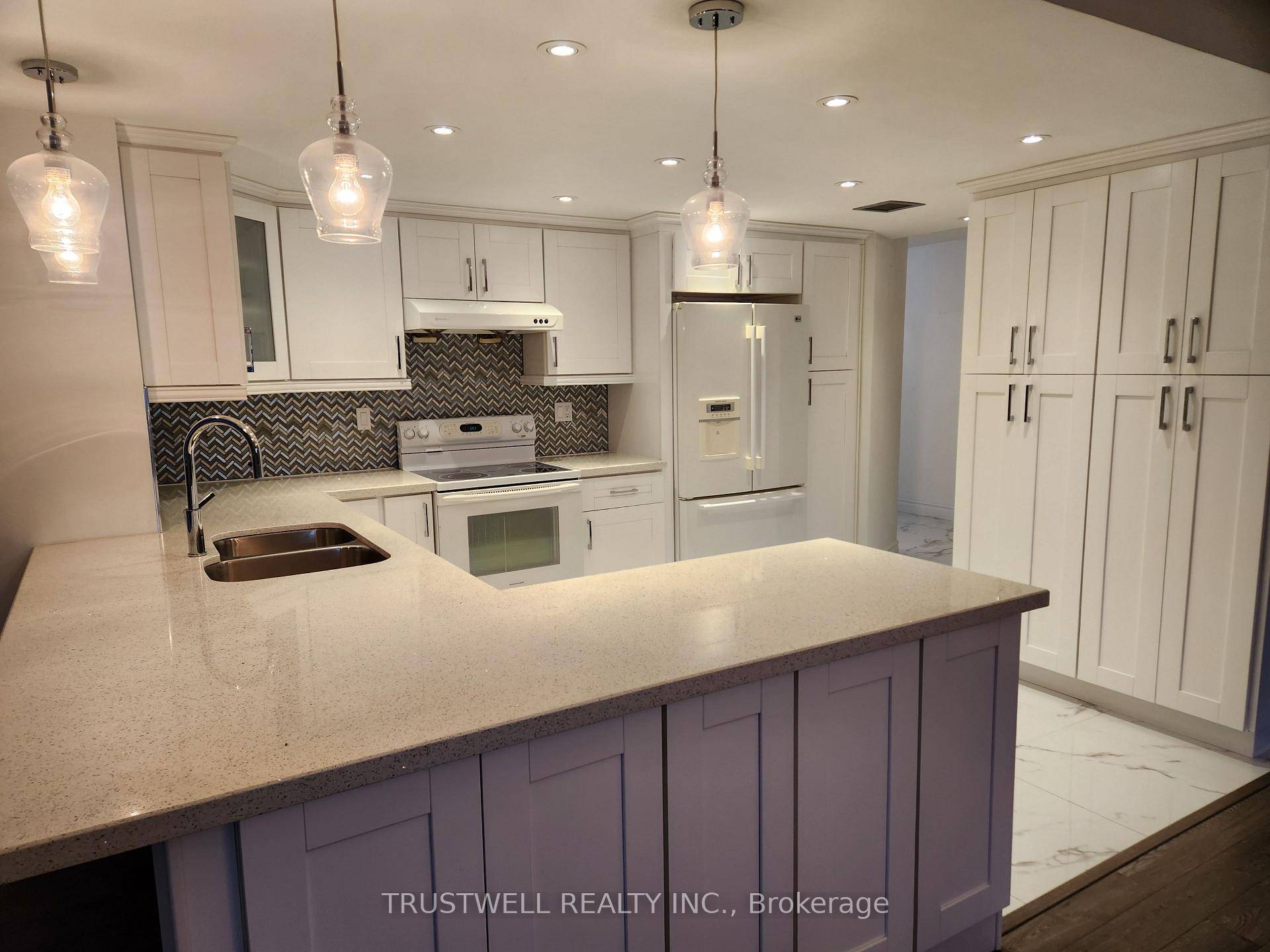 Luxury condo renovated unit, open concept kitchen, pantry and stainless steel appliances.