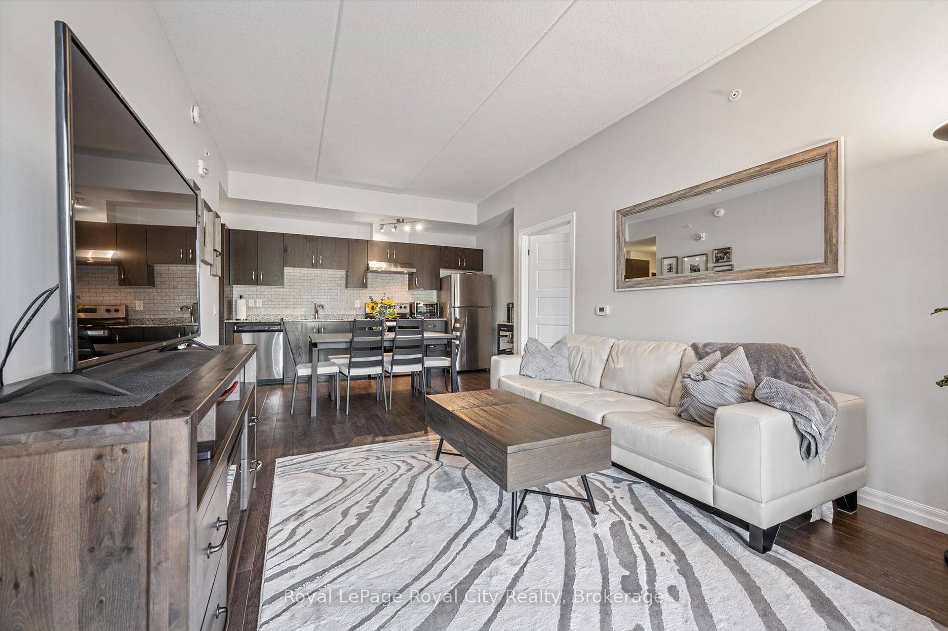 Welcome to 12135 Kingsbury Square a stylish, move in ready condo in Guelphs popular south end !
