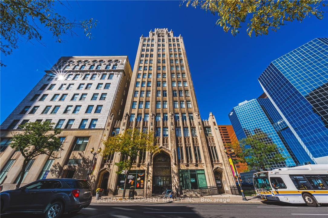 Light filled, open concept, corner unit, condo apartment in the historical Hamilton landmark The Pigott building.
