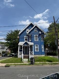 Two family with a third level on a corner lot.