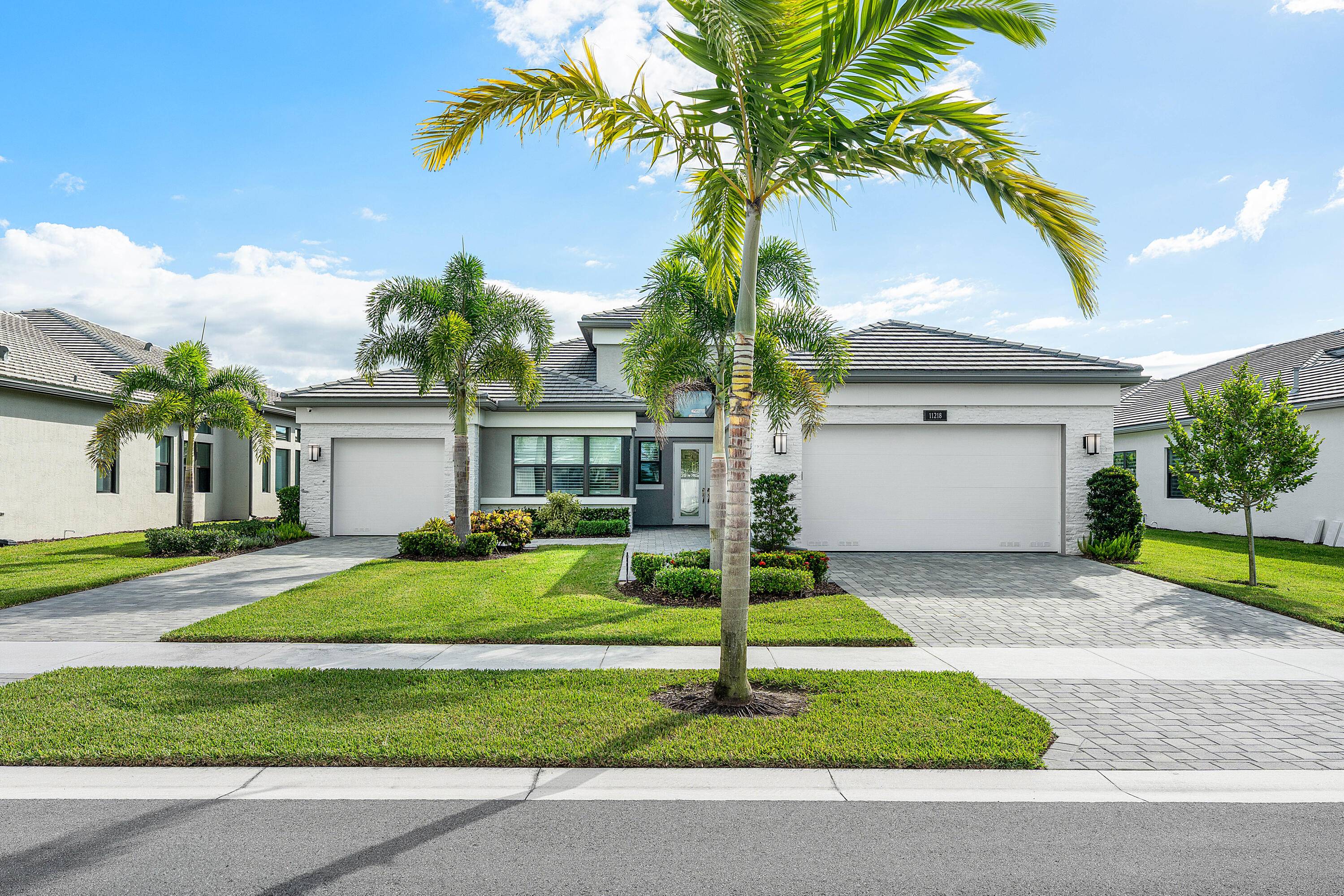 Lushly landscaped Napa model on beautiful lakefront lot.