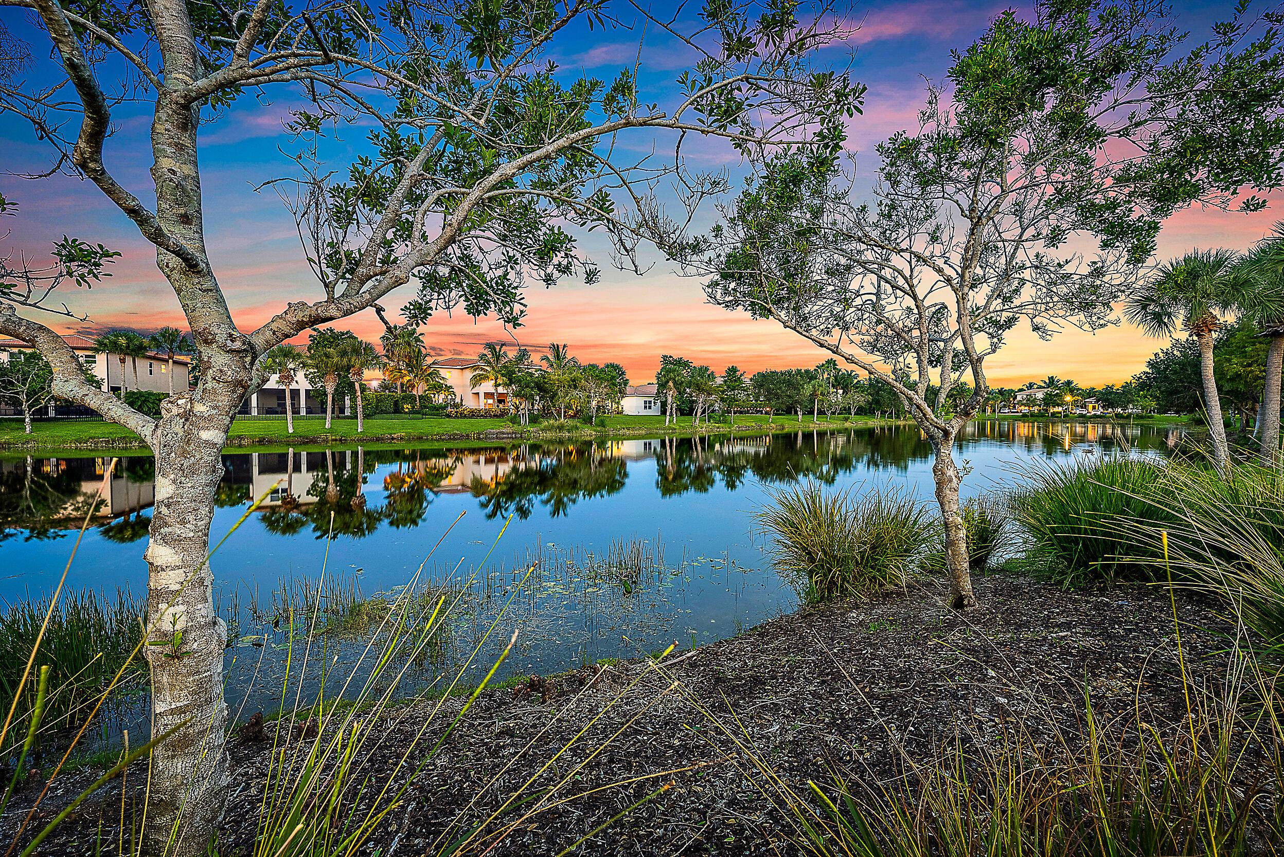 Completely renovated CBS one story lakefront home in the highly desirable gated community of Rialto in Jupiter.