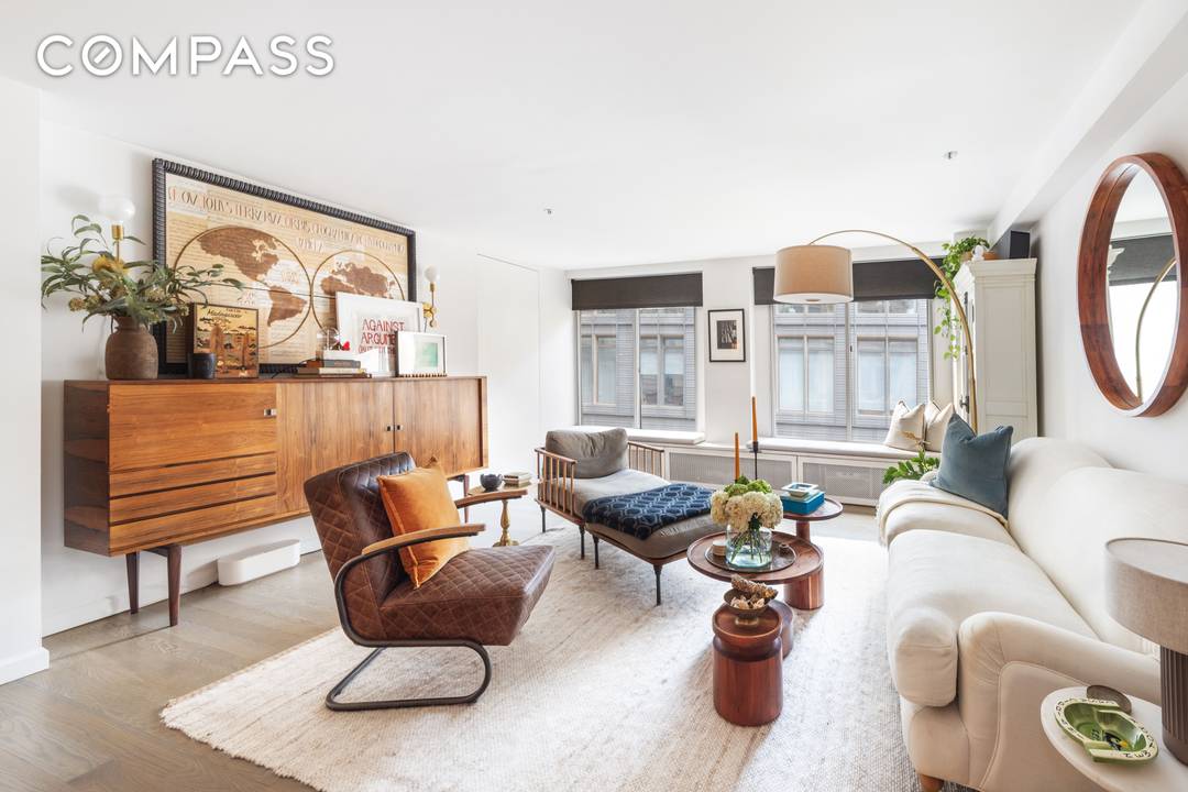 Stylish Tribeca Designer Condo with Home Office amp ; Luxe Finishes Located in the heart of Tribeca, this beautifully renovated designer condominium blends modern sophistication with loft like charm.